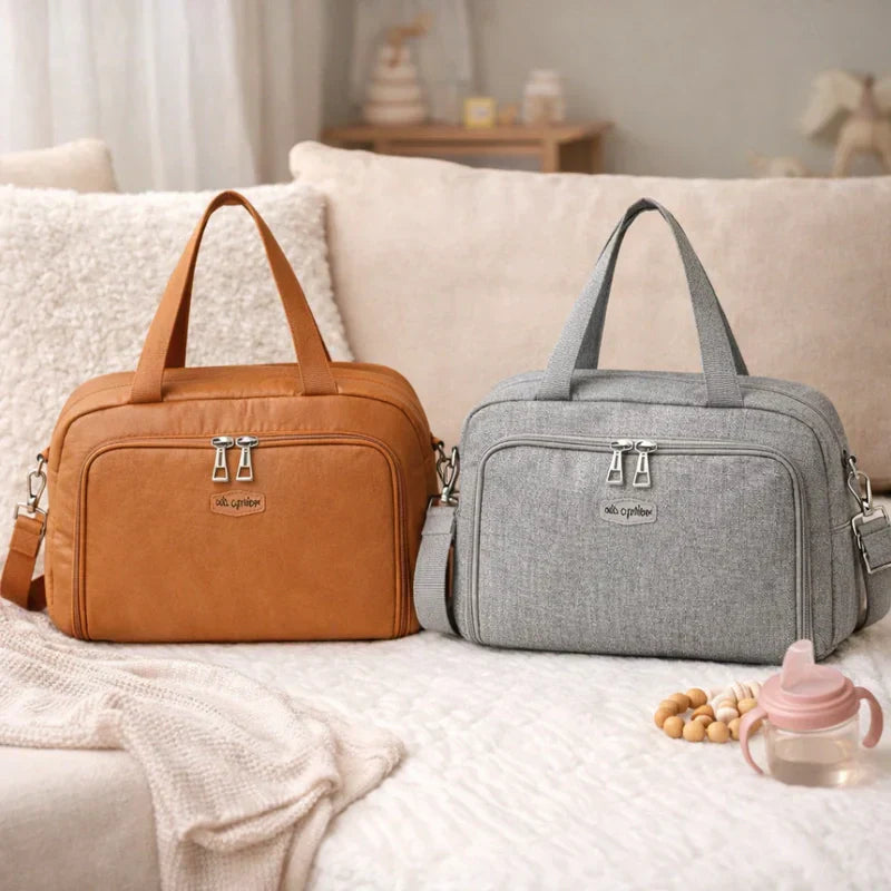 Sac à langer en cuir et un autre sac à langer en tissus