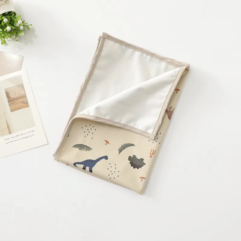 Matelas bébé à langer avec motifs dinosaures