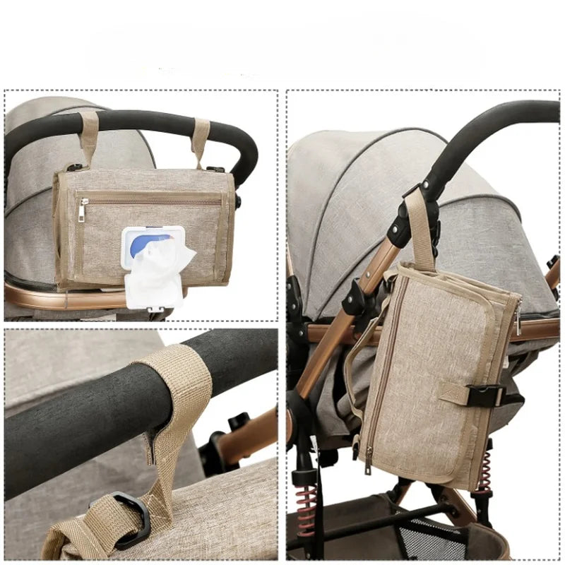 Matelas à langer nomade pour voyages marron suspendu à une poussette