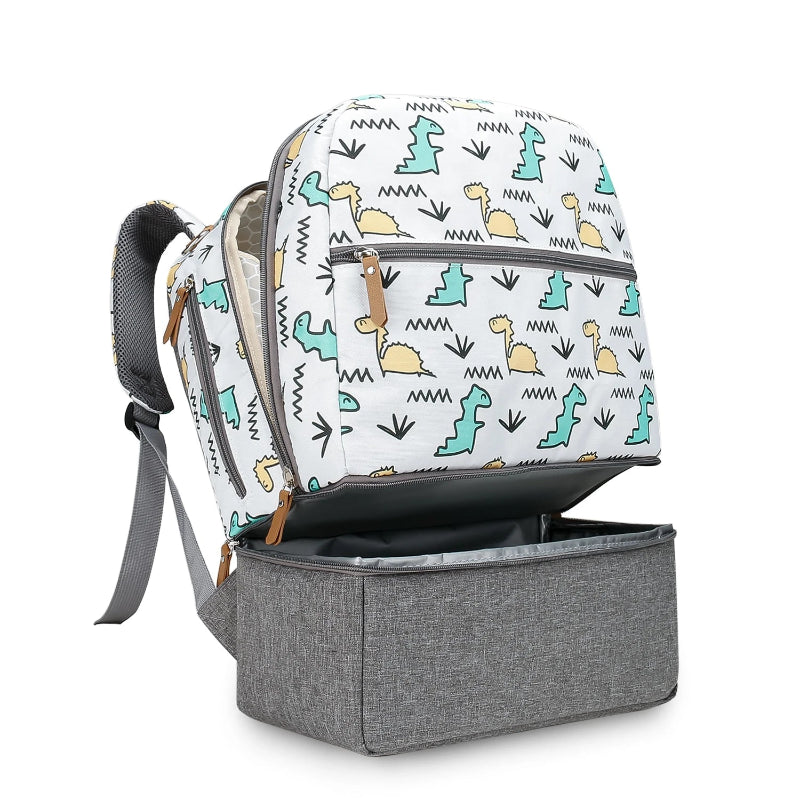 Poches du petit sac à dos à langer dinosaure