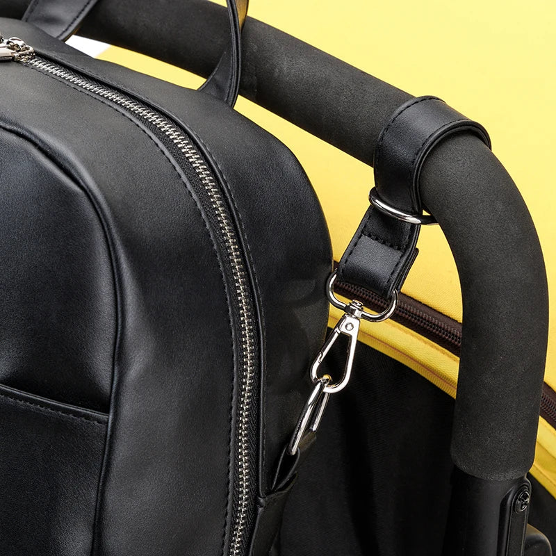 Sac à dos à langer imperméable suspendu à une poussette