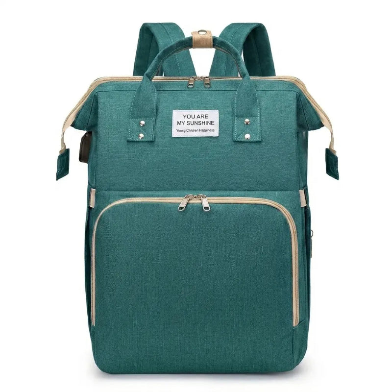 Sac à langer 3 en 1 vert sur fond blanc