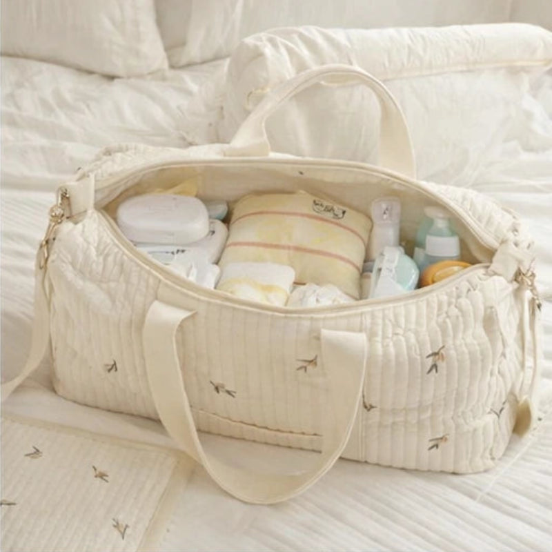 Sac a langer en gaze de coton sur un lit