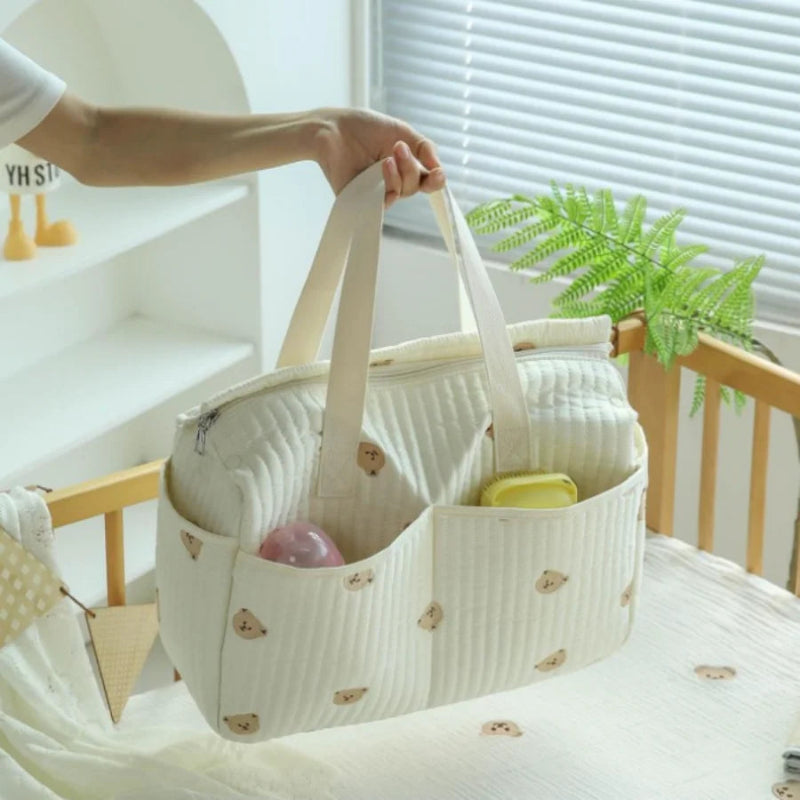 Sac à langer pour maman dans lit bébé