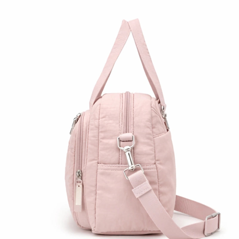 Sac à langer rose poudré​ de profil