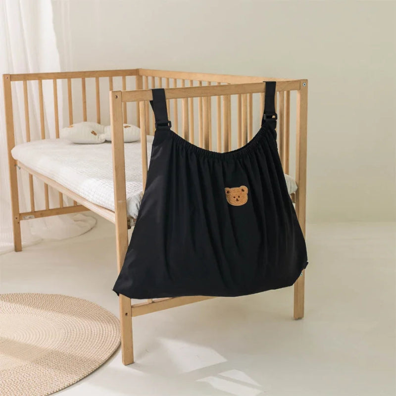 Sac rangement poussette suspendu à lit bébé
