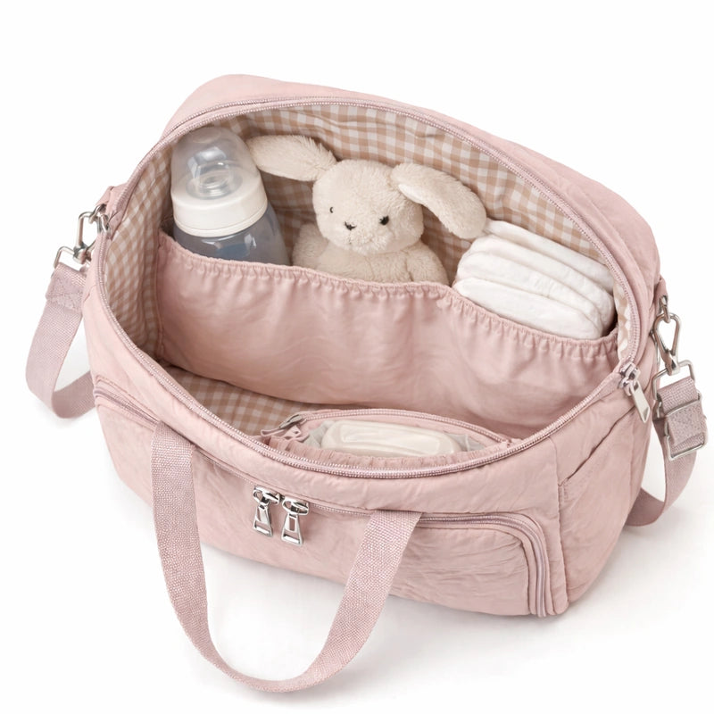 Intérieur du sac à langer rose poudré​